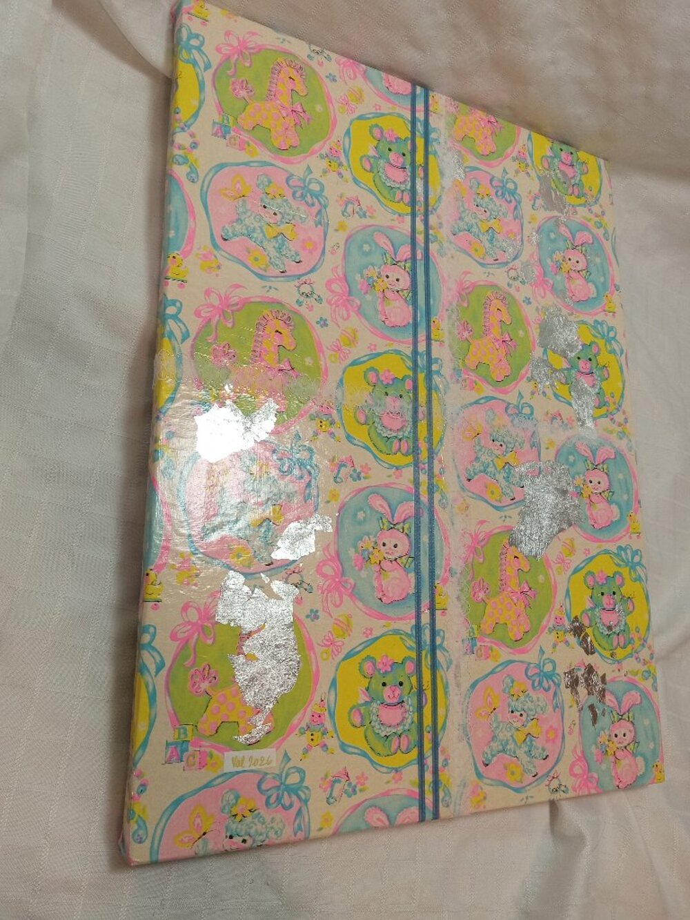 A delicate, handmade canvas made from thin vintage wrapping paper